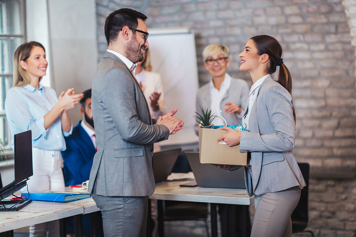 Team leader introducing a new employee to colleagues in a modern office
