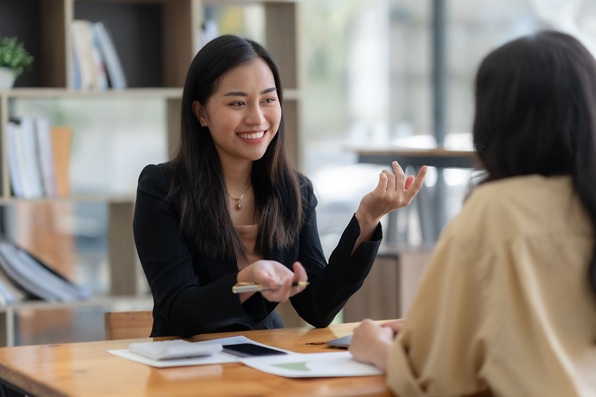Manager and employee having a serious one-on-one conversation in an office